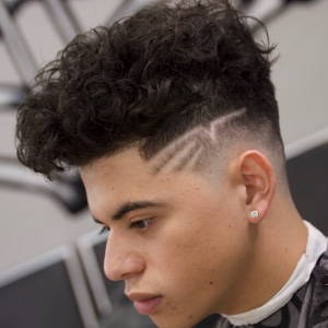 Curly top with burst fade and razor design
