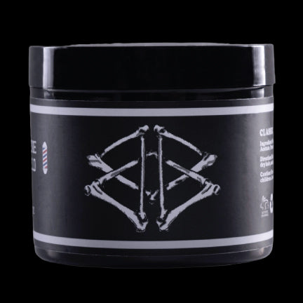 Boneyard Shine Pomade jar on a black background